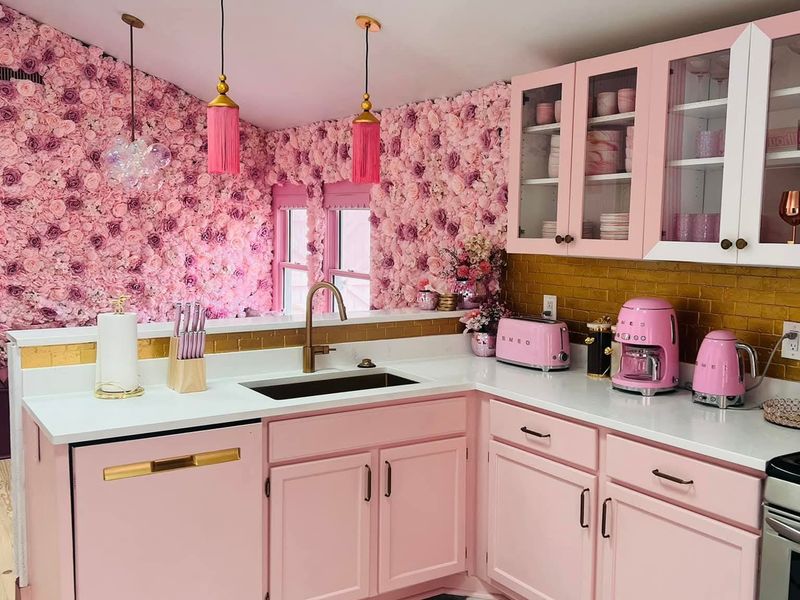 Pink retro kitchen with black-and-white checkered floor, wiped down and guest-ready